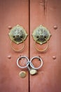 Chinese lion doorknob and padlock on close brown wood door background Royalty Free Stock Photo