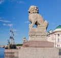 Chinese Lions Chi Tza on the Petrovskaya embankment and the floating restaurant Blagodat. Royalty Free Stock Photo