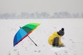 Boy with umbrella in snowy Summer Palace Royalty Free Stock Photo