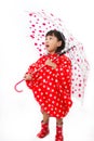 Chinese Little Girl Holding umbrella with raincoat Royalty Free Stock Photo