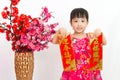 Chinese little girl pising holding Spring festival couplets