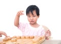 Chinese little girl is playing Chinese chess seriously Royalty Free Stock Photo