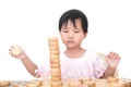 Chinese little girl playing with traditional Chinese chess pieces in front of white background Royalty Free Stock Photo