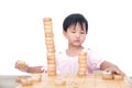 Chinese little girl playing with traditional Chinese chess pieces in front of white background Royalty Free Stock Photo