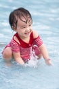 Chinese Little Girl Playing in Water Royalty Free Stock Photo