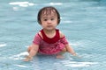 Chinese Little Girl Playing in Water Royalty Free Stock Photo