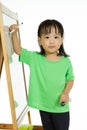 Chinese little girl writing on whiteboard Royalty Free Stock Photo