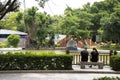 Chinese lover people sit on stone bench and relaxing in garden at Zhongshan Park in Shantou city or Swatow city in China Royalty Free Stock Photo