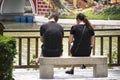 Chinese lover people sit on stone bench and relaxing in garden at Zhongshan Park in Shantou city or Swatow city in China Royalty Free Stock Photo