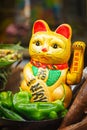 Chinese lucky cats on food market