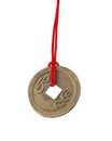 Chinese lucky old coin with red tape isolated on the white Royalty Free Stock Photo
