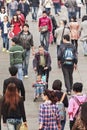 Chinese Man with baby-car in Crowd