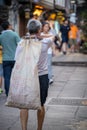 Chinese man carrying heavy load Royalty Free Stock Photo