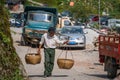 Chinese man carrying heavy load Royalty Free Stock Photo