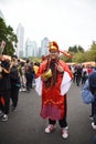 A Chinese man dressed as the god of wealth in China celebrates the Chinese New Year
