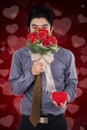 Chinese man holds a gift and flower Royalty Free Stock Photo