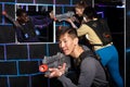 Chinese man during lasertag game in dark room Royalty Free Stock Photo