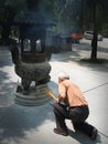 Chinese man lighting insence