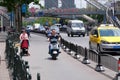 Chinese man riding scooter in Shanghai