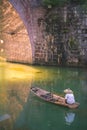 Man on old wooden boat in Fenghuang Royalty Free Stock Photo