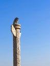 Chinese marble carved columns Huabiao against a clear blue sky.