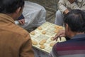 Chinese men playing `Xiangqi`, also known as `Chinese Chess`, a popular strategy board game