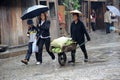 Chinese Miao nationality woman in the rain Royalty Free Stock Photo