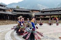 The Chinese miao women wearing traditional clothes and dancing in open opera house of Xijiang Qianhu Miao Village The One