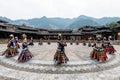 The Chinese miao women wearing traditional clothes and dancing in open opera house of Xijiang Qianhu Miao Village The One