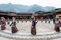 The Chinese miao women wearing traditional clothes and dancing in open opera house of Xijiang Qianhu Miao Village The One