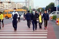 Chinese middle school students cross the road and wear masks