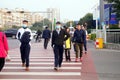 Chinese middle school students cross the road and wear masks