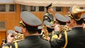 Chinese military band play national anthem during parliament meeting