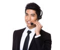 Chinese mixed Indian businessman with headset for hotline job as