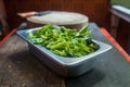 Chinese morning glory vegetable in the stainless cup ready for cooking Royalty Free Stock Photo