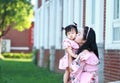 Chinese mother kiss her little daughter Royalty Free Stock Photo