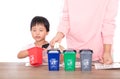 Chinese mothers teach their children how to classify trash in their lives