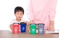 Chinese mothers teach their children how to classify trash in their lives