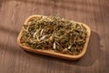 Chinese motherwort (Leonurus japonicus) with dish decorated on wooden table