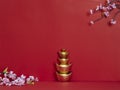 Chinese New Year background. Flowers and chinese gold ingot