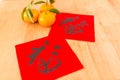 Chinese New Year Calligraphy with mandarin orange, words meaning Royalty Free Stock Photo