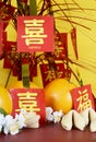 Chinese New Year celebration party table on red and yellow wood background Royalty Free Stock Photo