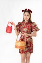 Chinese New Year concept, Woman holding a basket of food and red basket ,meaning to be happy healthy and wealthy year, Chinese New