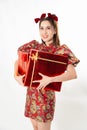 Chinese New Year concept, Woman holding red present gift box to give in Chinese New Year Celebration