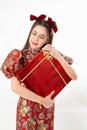 Chinese New Year concept, Woman holding red present gift box to give in Chinese New Year Celebration