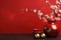 Chinese New Year decoration on a red background. Flowers of good fortune and lump of gold. Chinese new year festival