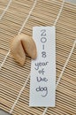 A fortune cookie and a note 2018 year of the dog Royalty Free Stock Photo