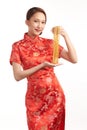 Chinese new year festival, Beautiful Young asian woman wearing traditional cheongsam qipao dress with gold necklaces on white Royalty Free Stock Photo