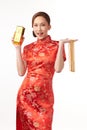 Chinese new year festival, Beautiful Young asian woman wearing traditional cheongsam qipao dress with gold necklaces on white Royalty Free Stock Photo