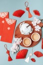 Chinese new year festival decoration over blue background. Traditional lunar new year flat lay Royalty Free Stock Photo